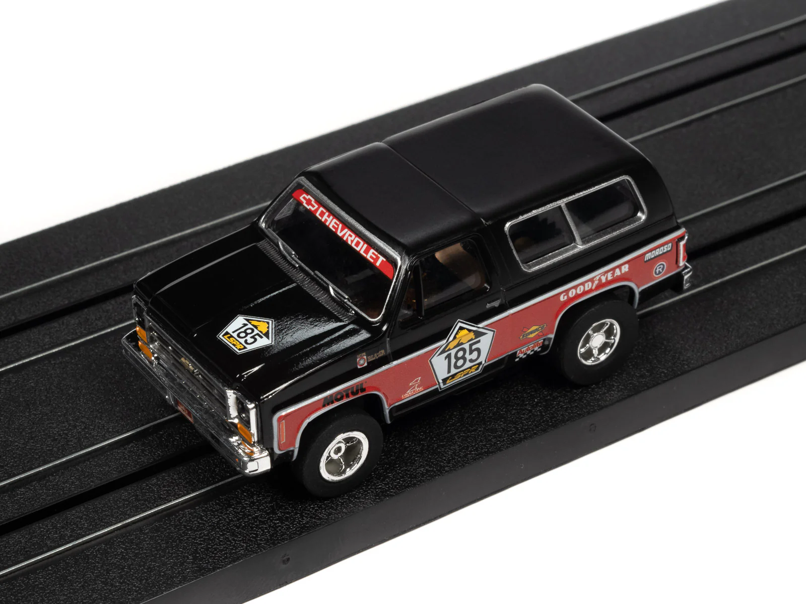 Auto World Xtraction 1977 Chevrolet Blazer (Black, Red) HO Slot Car - Image 4