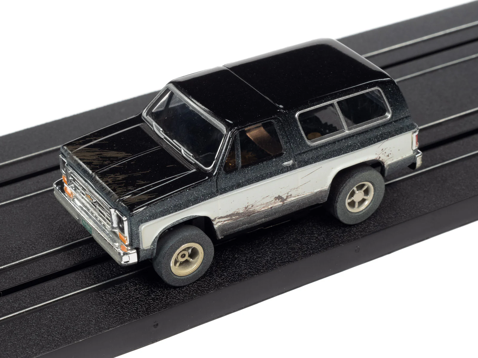 Auto World Xtraction 1977 Chevrolet Blazer (Black/White) HO Scale Slot Car - Image 4