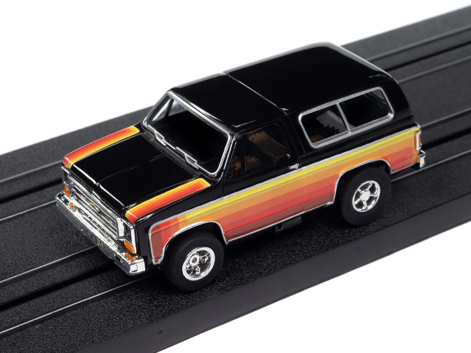 Auto World Xtraction 1979 Chevy Blazer - Black w/ Red & Yellow Side Panels HO Scale Slot Car - Image 4